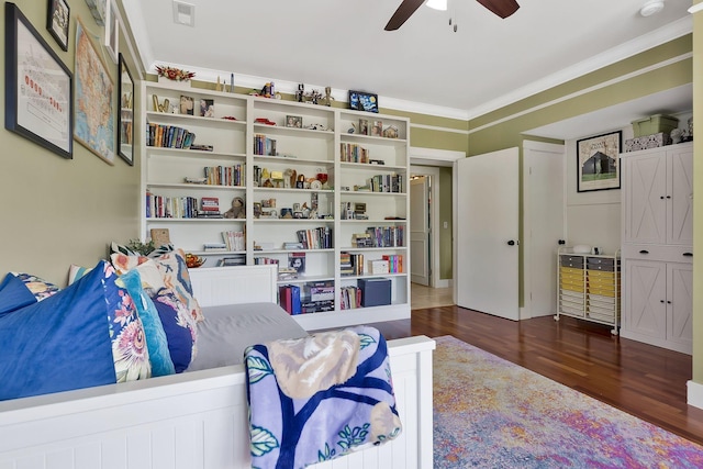 sitting room with ornamental molding, dark hardwood / wood-style floors, and ceiling fan