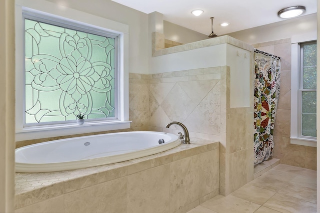 bathroom with independent shower and bath, tile walls, and tile patterned floors