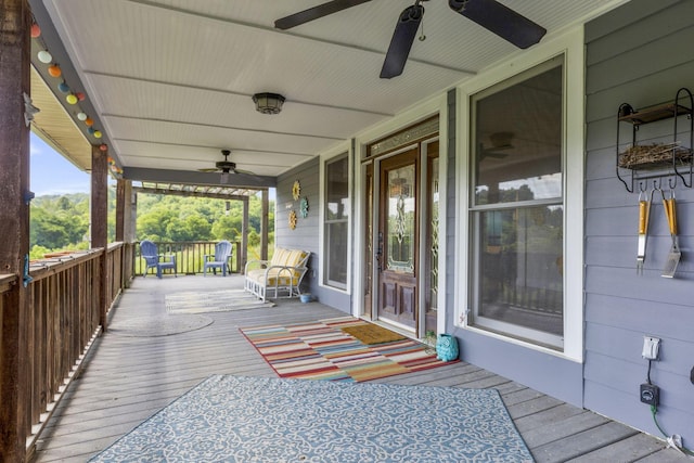 wooden deck with ceiling fan and covered porch