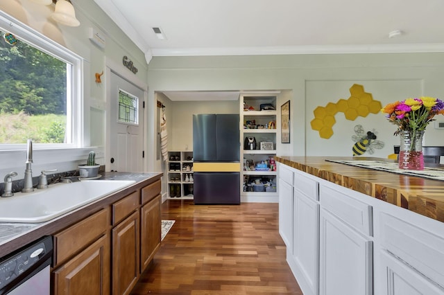 kitchen featuring white cabinetry, dishwasher, sink, ornamental molding, and dark wood-type flooring