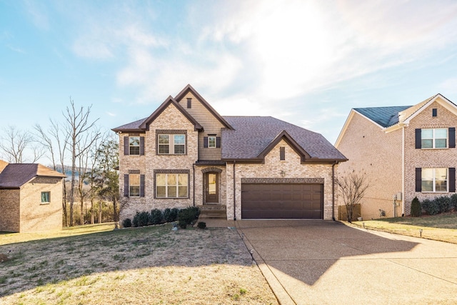 view of front of home featuring a garage and a front yard