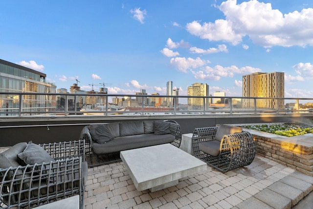 view of patio with an outdoor hangout area and a balcony