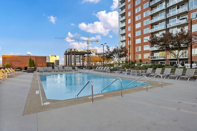 view of swimming pool with a patio