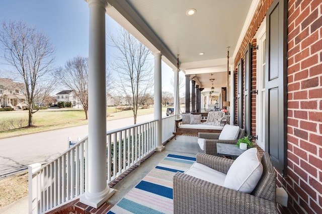 balcony featuring covered porch