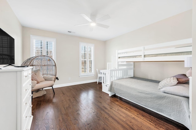 bedroom with dark wood-type flooring and ceiling fan