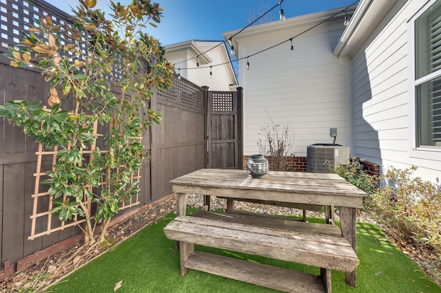 wooden terrace featuring central AC unit