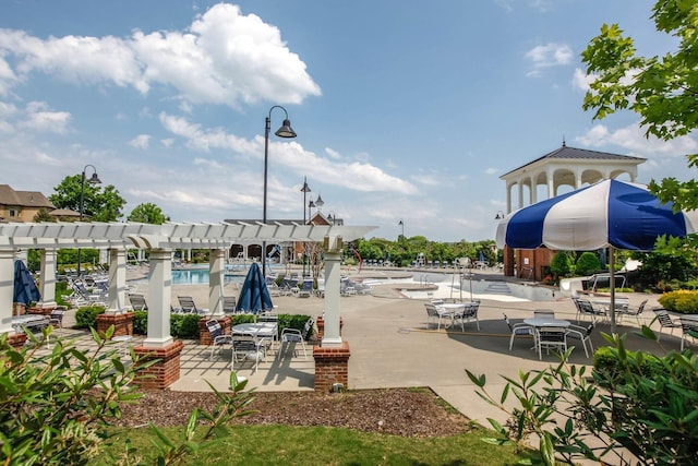 view of home's community featuring a pergola