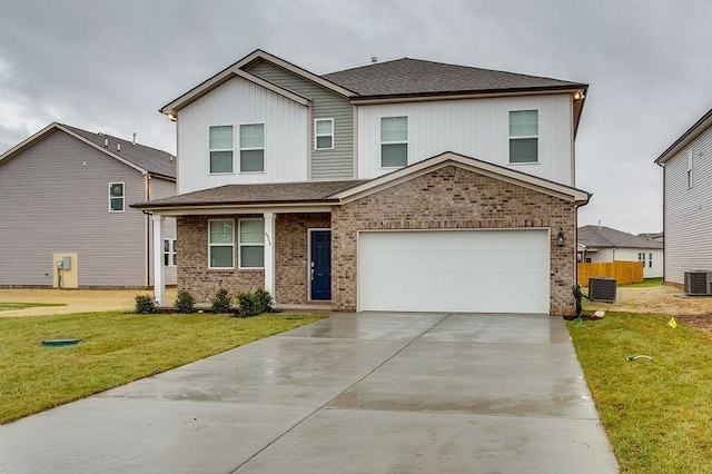 front of property with central AC, a garage, and a front yard