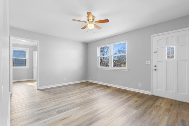 entrance foyer with ceiling fan and light hardwood / wood-style floors