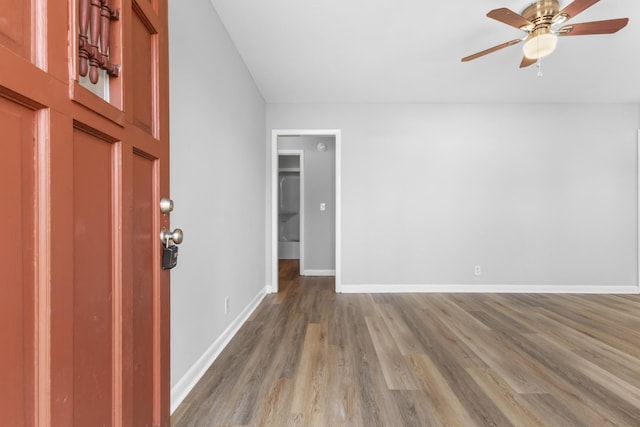 entrance foyer featuring ceiling fan and wood-type flooring