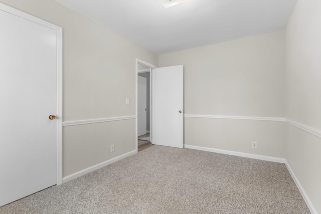 unfurnished bedroom featuring carpet