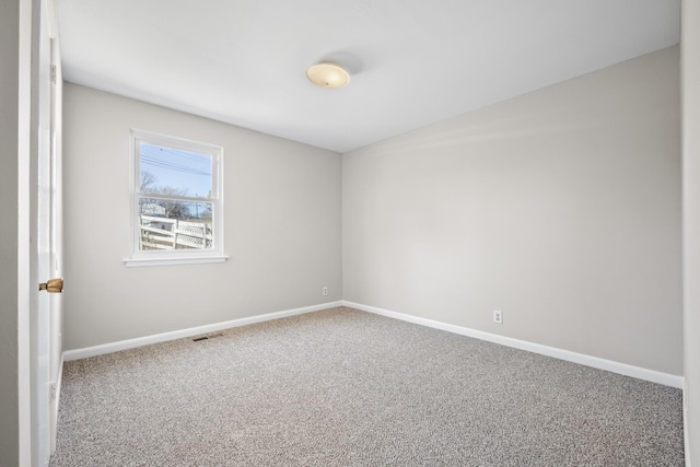 empty room featuring carpet flooring