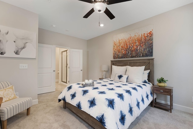 bedroom featuring light carpet and ceiling fan