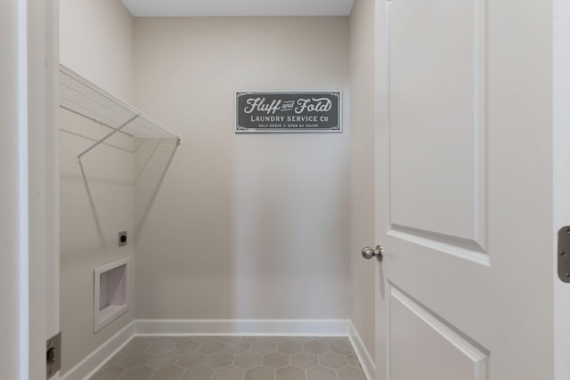 laundry room featuring tile patterned flooring and electric dryer hookup