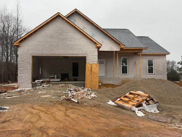 property in mid-construction with a garage