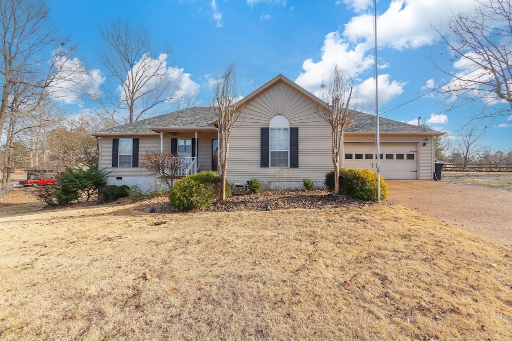 ranch-style home featuring a garage