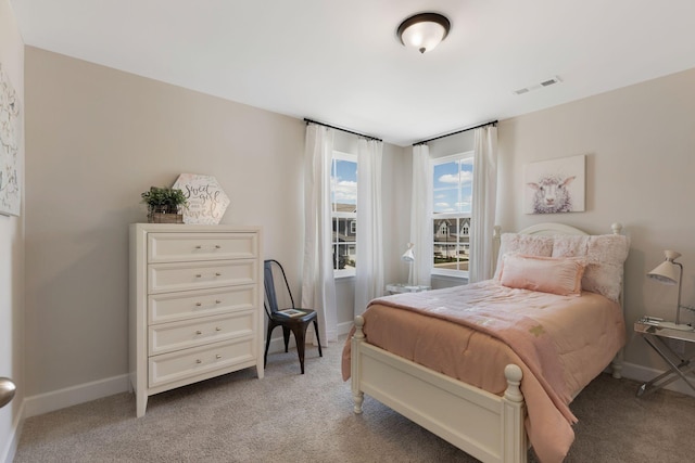 bedroom with light colored carpet