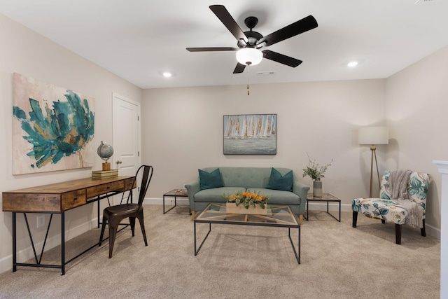 living room featuring light carpet and ceiling fan