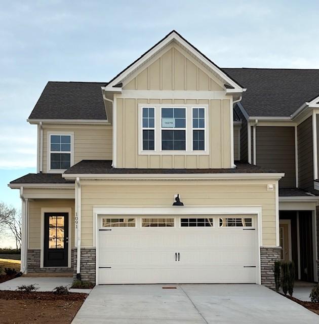 craftsman house with a garage