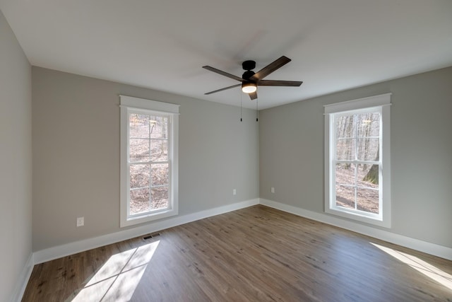 spare room featuring ceiling fan and light hardwood / wood-style flooring