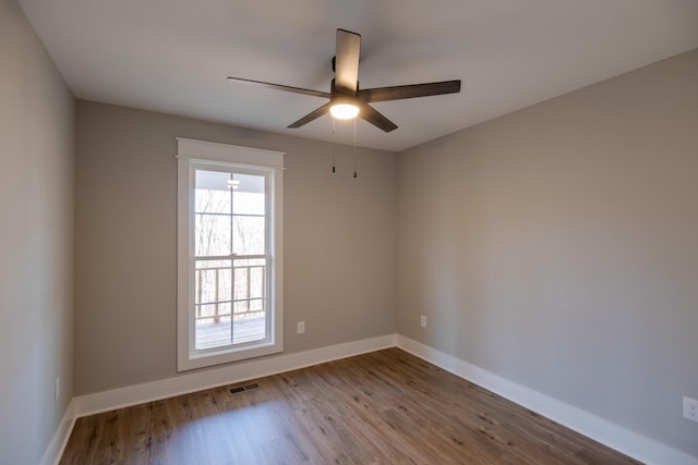 spare room featuring light hardwood / wood-style floors and ceiling fan