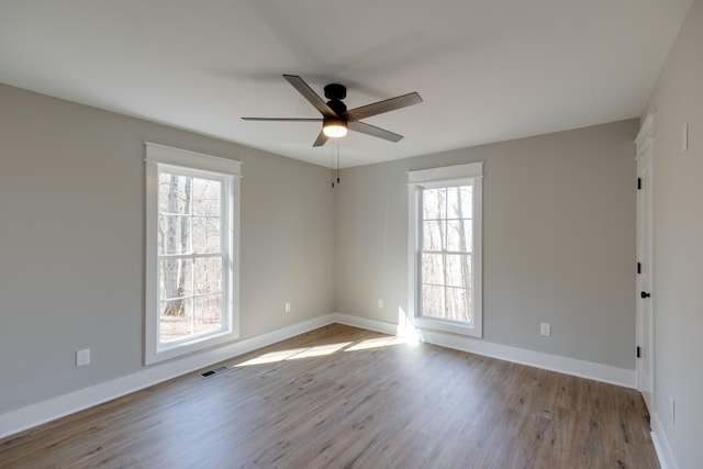 empty room featuring light hardwood / wood-style floors and ceiling fan