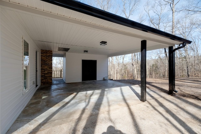 view of patio / terrace featuring a carport