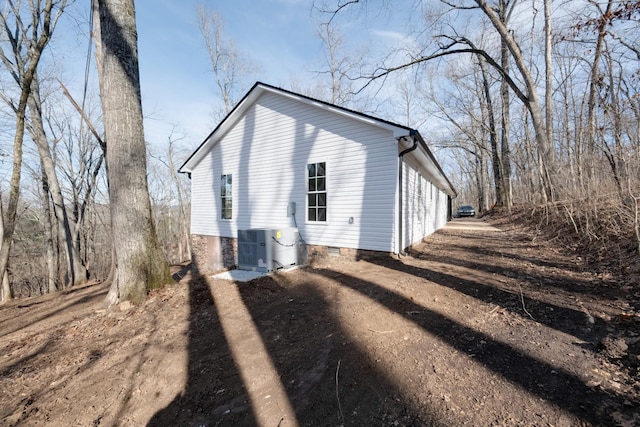 view of side of property featuring cooling unit