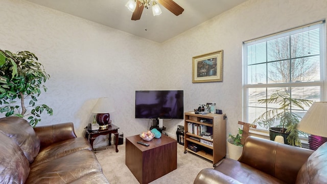 living room featuring ceiling fan and light carpet