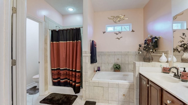 full bathroom featuring vanity, toilet, tile patterned flooring, and shower with separate bathtub