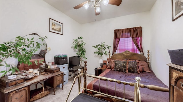 bedroom featuring light colored carpet and ceiling fan