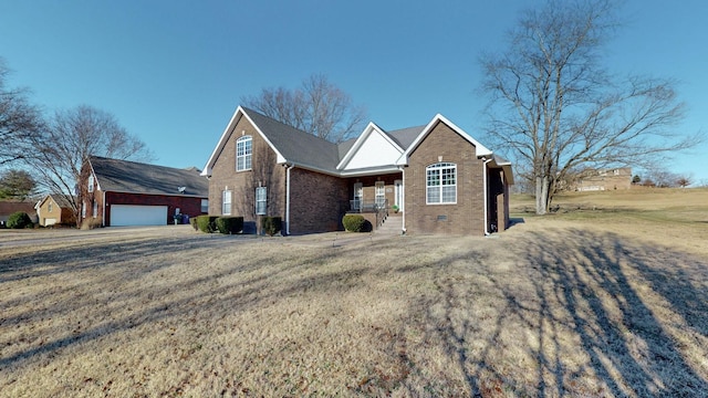 view of front of home with a garage, a porch, and a front lawn