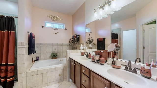 bathroom featuring independent shower and bath, vanity, and tile patterned floors