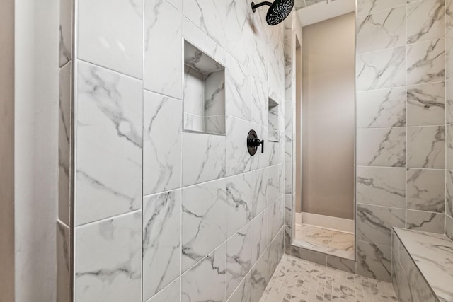 bathroom featuring a tile shower