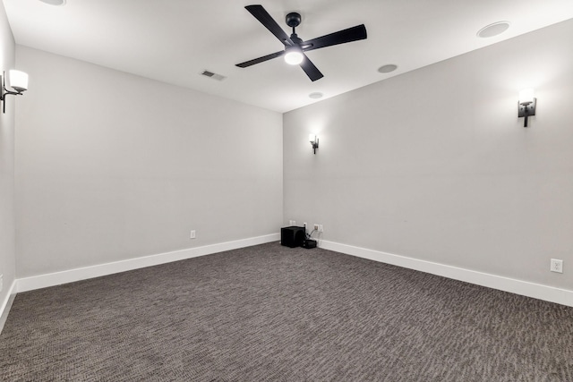 carpeted home theater room featuring ceiling fan