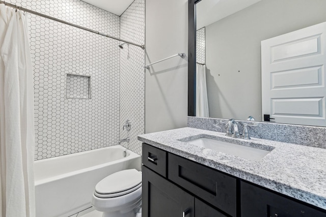 full bathroom featuring vanity, toilet, and shower / bath combo with shower curtain