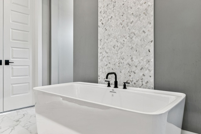 bathroom with a tub to relax in