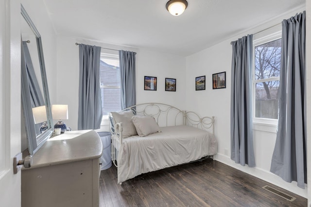 bedroom featuring dark hardwood / wood-style flooring