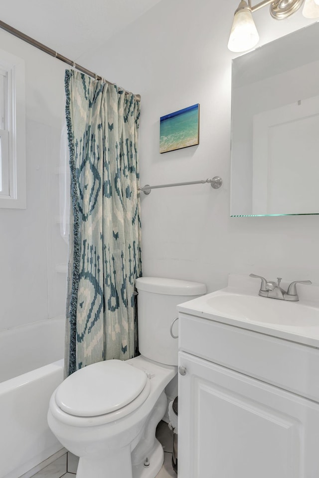 full bathroom with vanity, toilet, and shower / tub combo with curtain