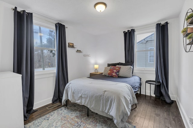 bedroom featuring dark wood-type flooring