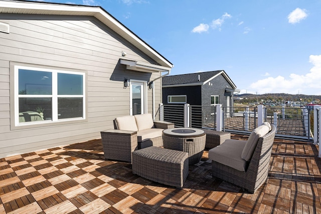 wooden terrace with an outdoor hangout area