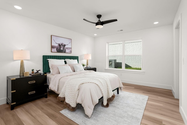 bedroom featuring light wood-type flooring and ceiling fan