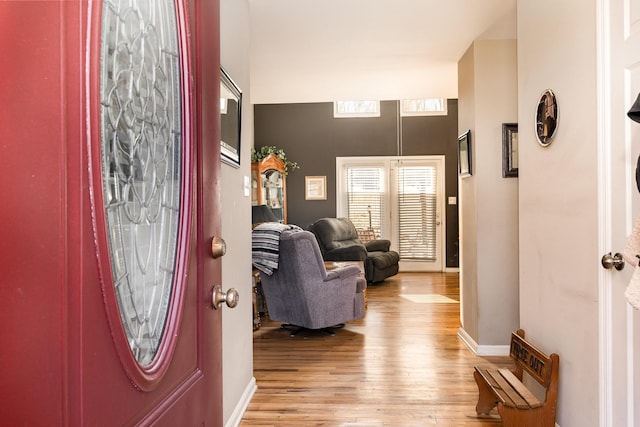 entryway with light hardwood / wood-style floors