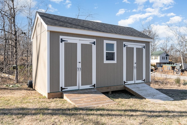 view of outbuilding with a lawn