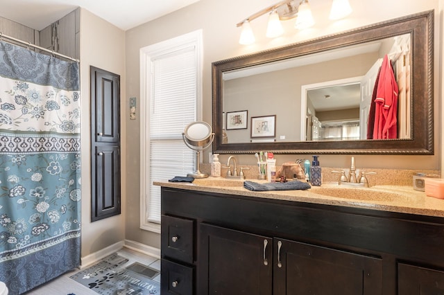 bathroom featuring tile patterned floors and vanity