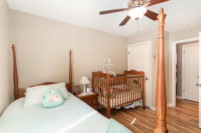 bedroom with ceiling fan and light wood-type flooring