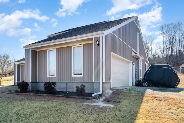 view of property exterior with a garage and a lawn