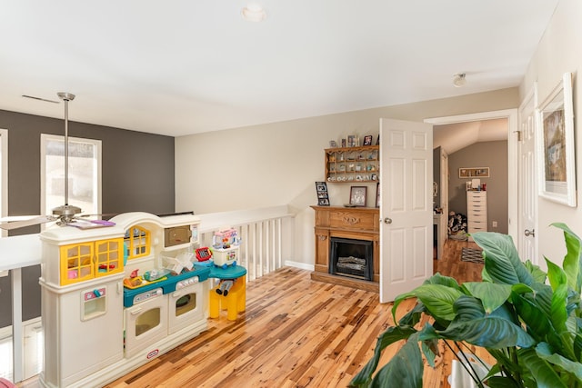 recreation room featuring ceiling fan and light wood-type flooring