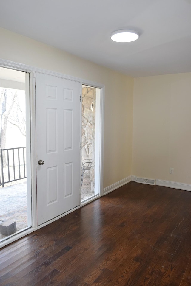 foyer featuring dark hardwood / wood-style floors