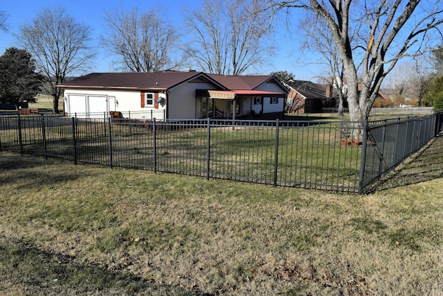 exterior space with a garage and a front lawn